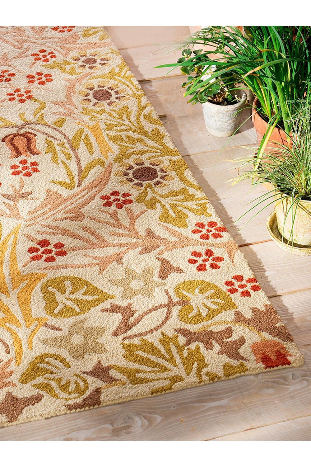 Morris & Co Blackthorn - Wheat Designer Outdoor Rug featuring botanical floral pattern in cream, mustard, olive and rust on warm wheat background