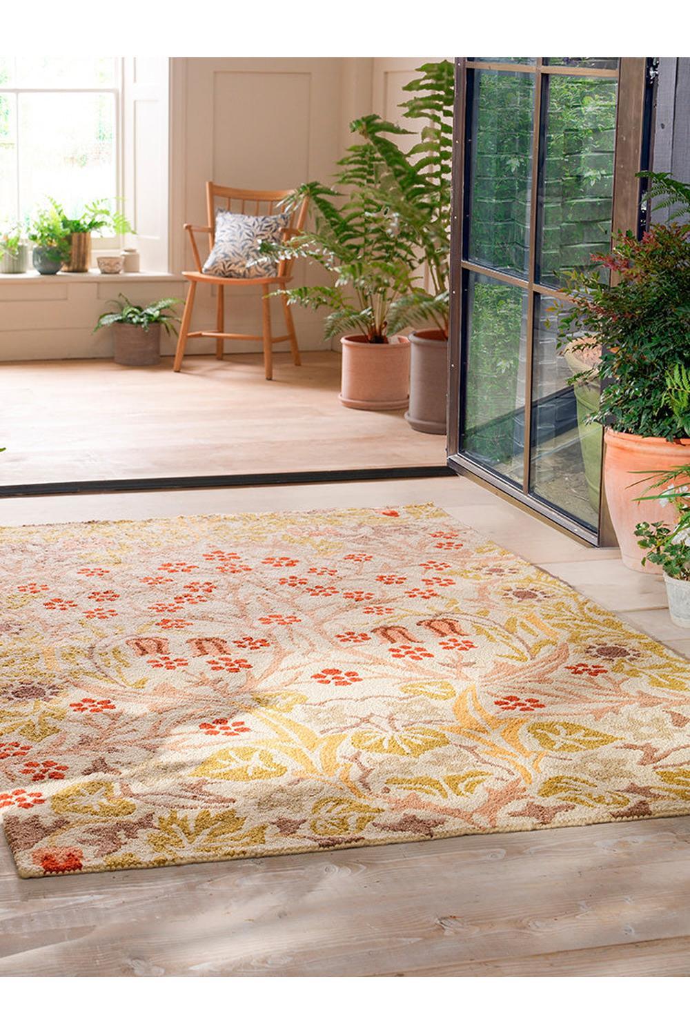 Morris & Co Blackthorn Wheat Outdoor Rug featuring botanical floral pattern in warm yellow, ochre and coral on light cream background, power-loomed polypropylene