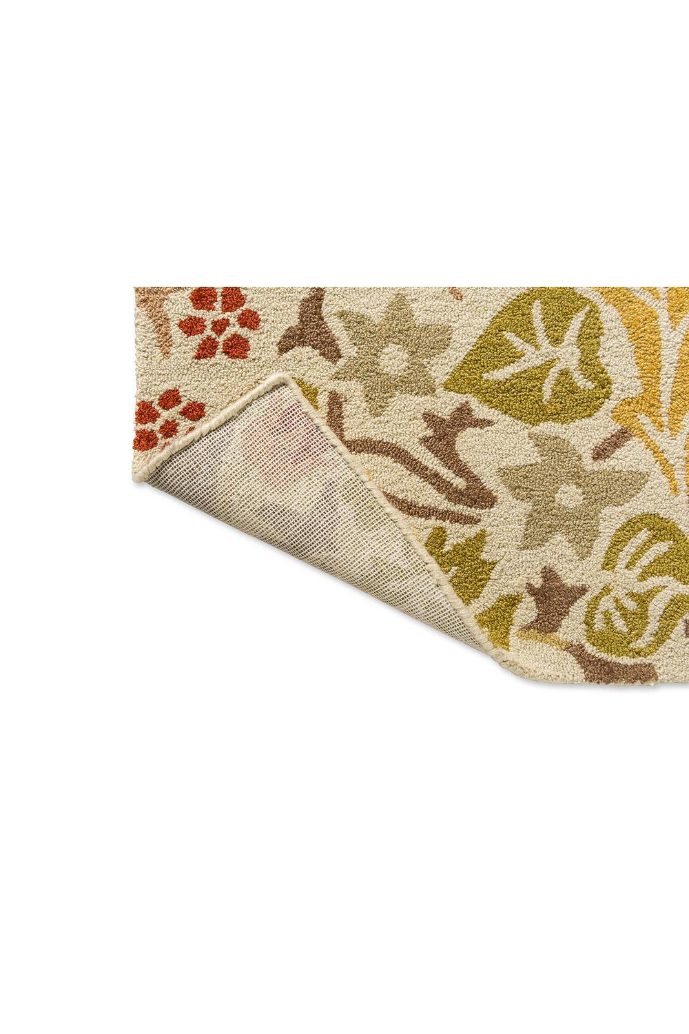 Morris & Co Blackthorn - Wheat outdoor rug featuring botanical floral pattern in cream, mustard, olive, brown and rust on wheat background, machine-woven polypropylene