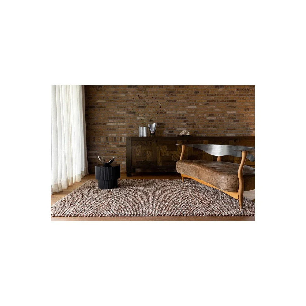 Brink & Campman Nest Leather Designer Rug featuring textured woven pattern in taupe, beige and cream on light brown background, hand-tufted wool