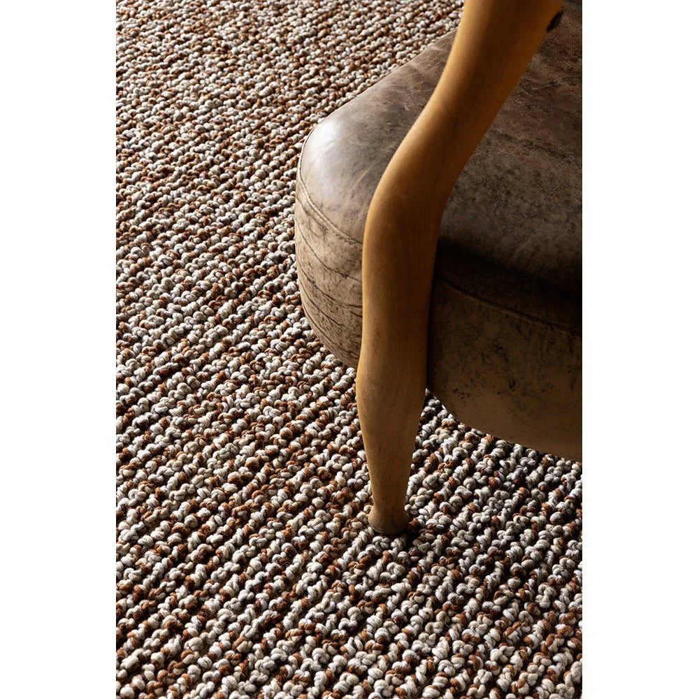 Nest Leather Designer Rug by Brink & Campman featuring textured loop pattern in beige, taupe and brown on natural background, hand-tufted wool