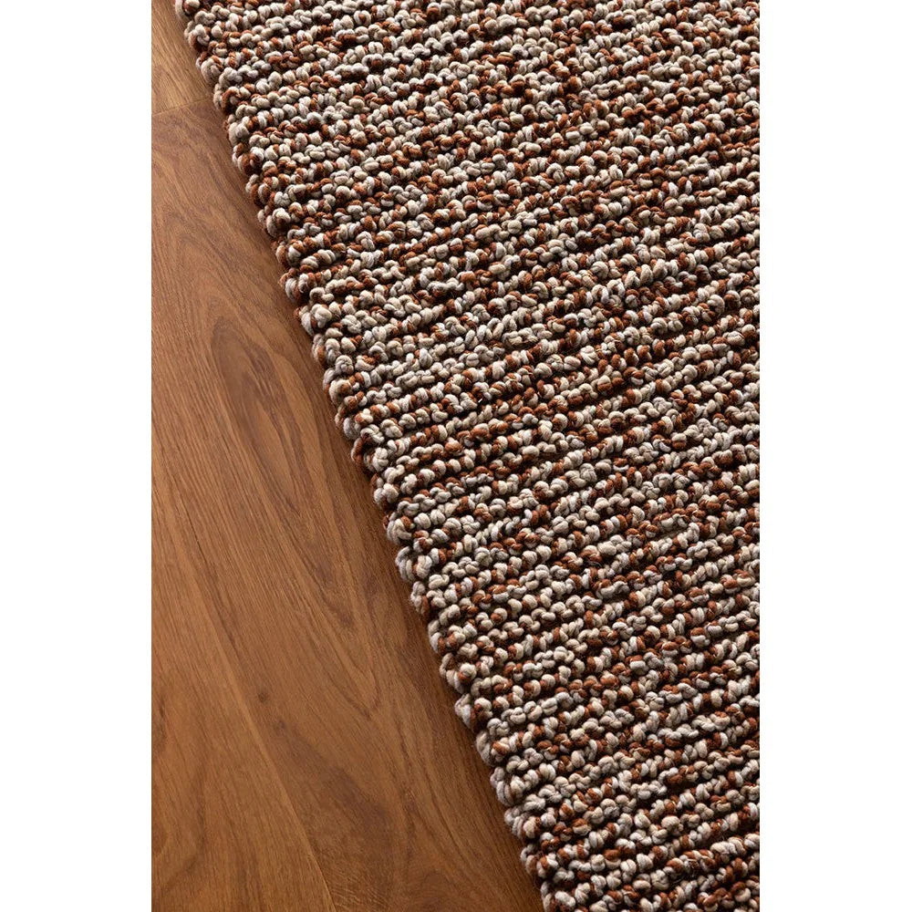 Nest Leather Designer Rug by Brink & Campman featuring chunky boucle in brown, cream and caramel on warm oak, hand-tufted wool