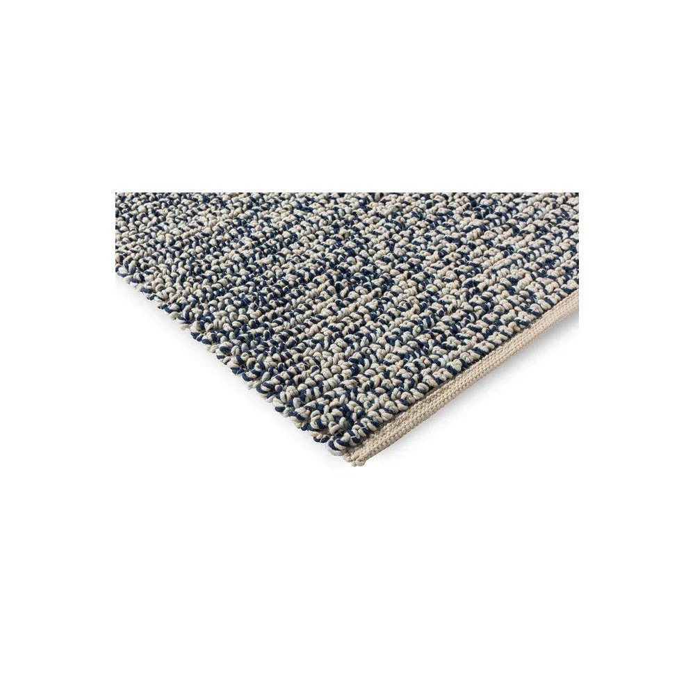 Brink & Campman Nest Ink Designer Rug featuring speckled loop pattern in navy, cream and indigo on beige, hand-tufted wool