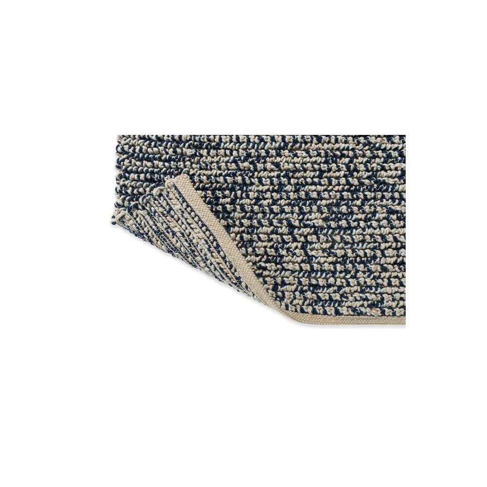 Brink & Campman Nest Ink Designer Rug featuring navy and ivory boucle weave on cream background, hand-loomed wool