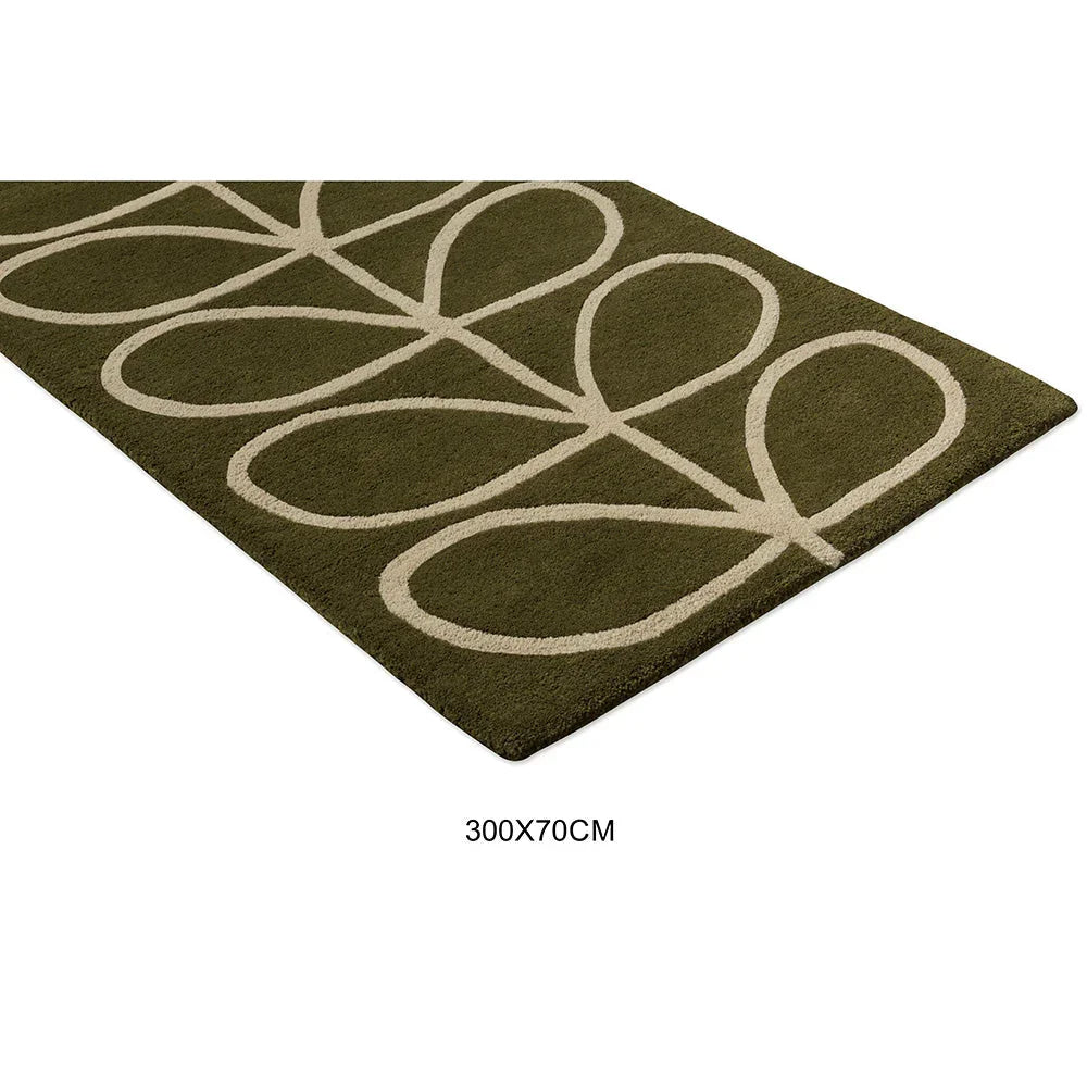 Orla Kiely Linear Stem Olive Runner Rug featuring abstract looping stem pattern in cream on olive background, machine-woven polypropylene