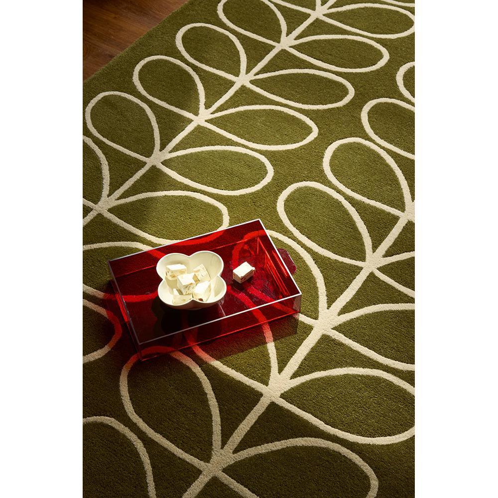 Orla Kiely Linear Stem Olive Rug featuring white linear stem pattern on olive green background, hand-tufted wool