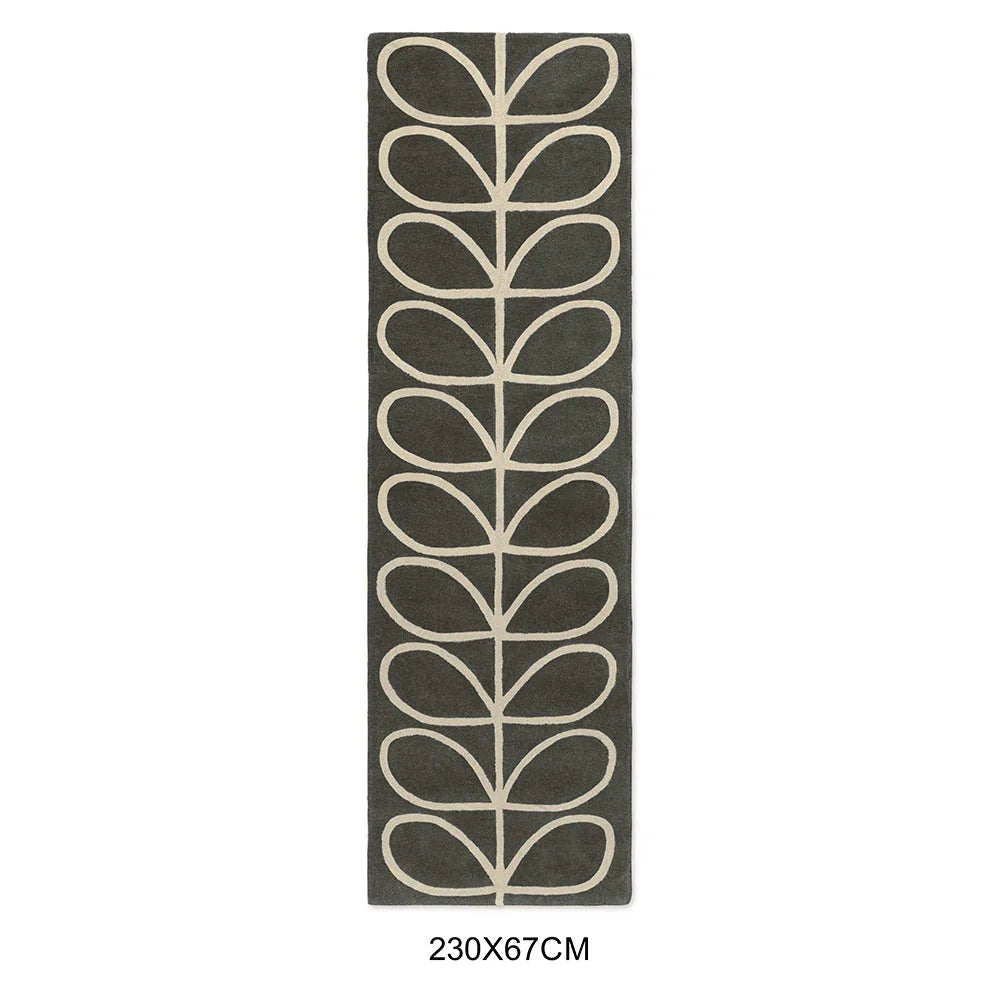 Orla Kiely Linear Stem Slate Runner Rug featuring leaf pattern in cream on slate background, hand-tufted wool