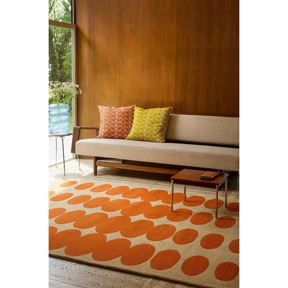 Orla Kiely Optical Oval Orange Sand Designer Rug featuring repeating orange oval pattern on sand background, hand-tufted wool