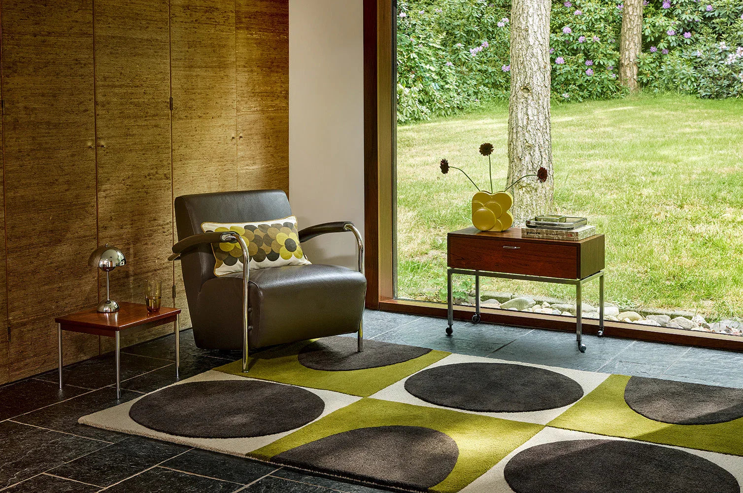 Orla Kiely Spot Square Walnut Lichen rug featuring circular pattern in charcoal grey, olive and cream on beige background, hand-tufted wool
