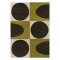 Orla Kiely Spot Square Walnut Lichen hand-tufted wool rug featuring bold mid-century geometric pattern with chocolate brown circles and half-circles on vibrant lichen green and cream blocks
