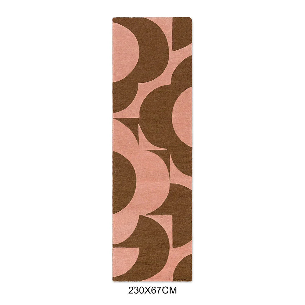 Orla Kiely Prism Flower Pink Terracotta Designer Rug featuring geometric rounded flower pattern in pink, terracotta and chocolate brown on soft pink background, hand-tufted wool