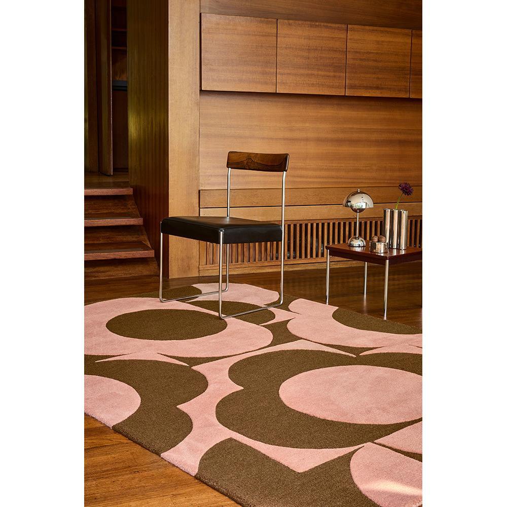 Orla Kiely Prism Flower Pink Terracotta rug featuring abstract florals in pink, terracotta and brown on pink background, hand-tufted wool