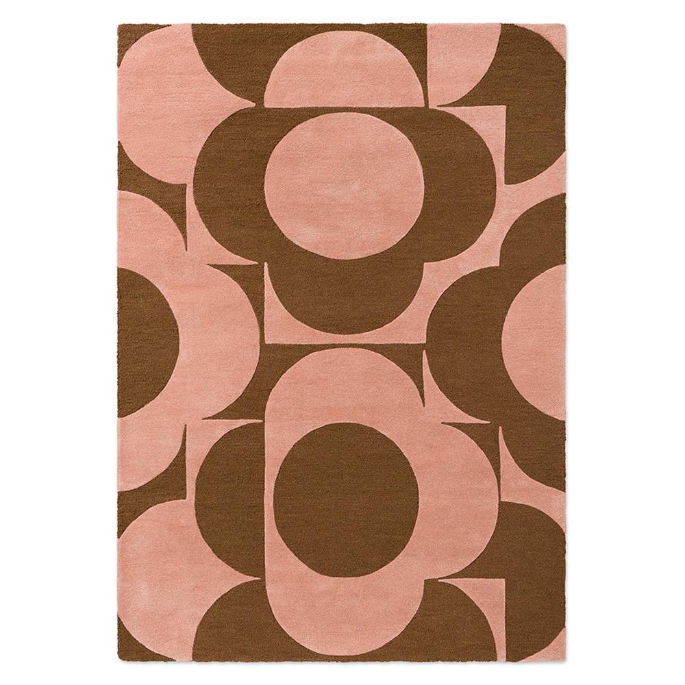 Orla Kiely Prism Flower Pink Terracotta hand-tufted wool rug featuring bold geometric overlapping floral motifs in soft blush pink and rich terracotta brown
