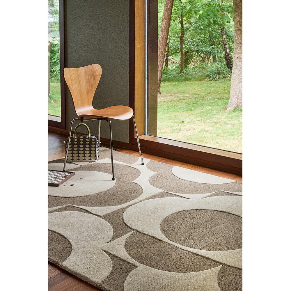 Orla Kiely Prism Flower Mushroom Ecru Rug with abstract circular pattern in cream, beige and taupe on light background, hand-tufted wool