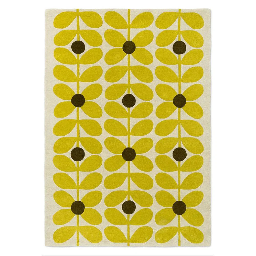Orla Kiely Sixties Stem Yellow hand-tufted wool rug featuring iconic stem leaf pattern with bright chartreuse yellow stylised flowers and olive brown centres on cream background
