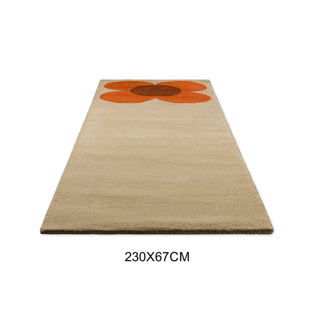 Orla Kiely Flower Placement Runner Rug featuring orange flower petals with brown center on beige background, hand-tufted wool