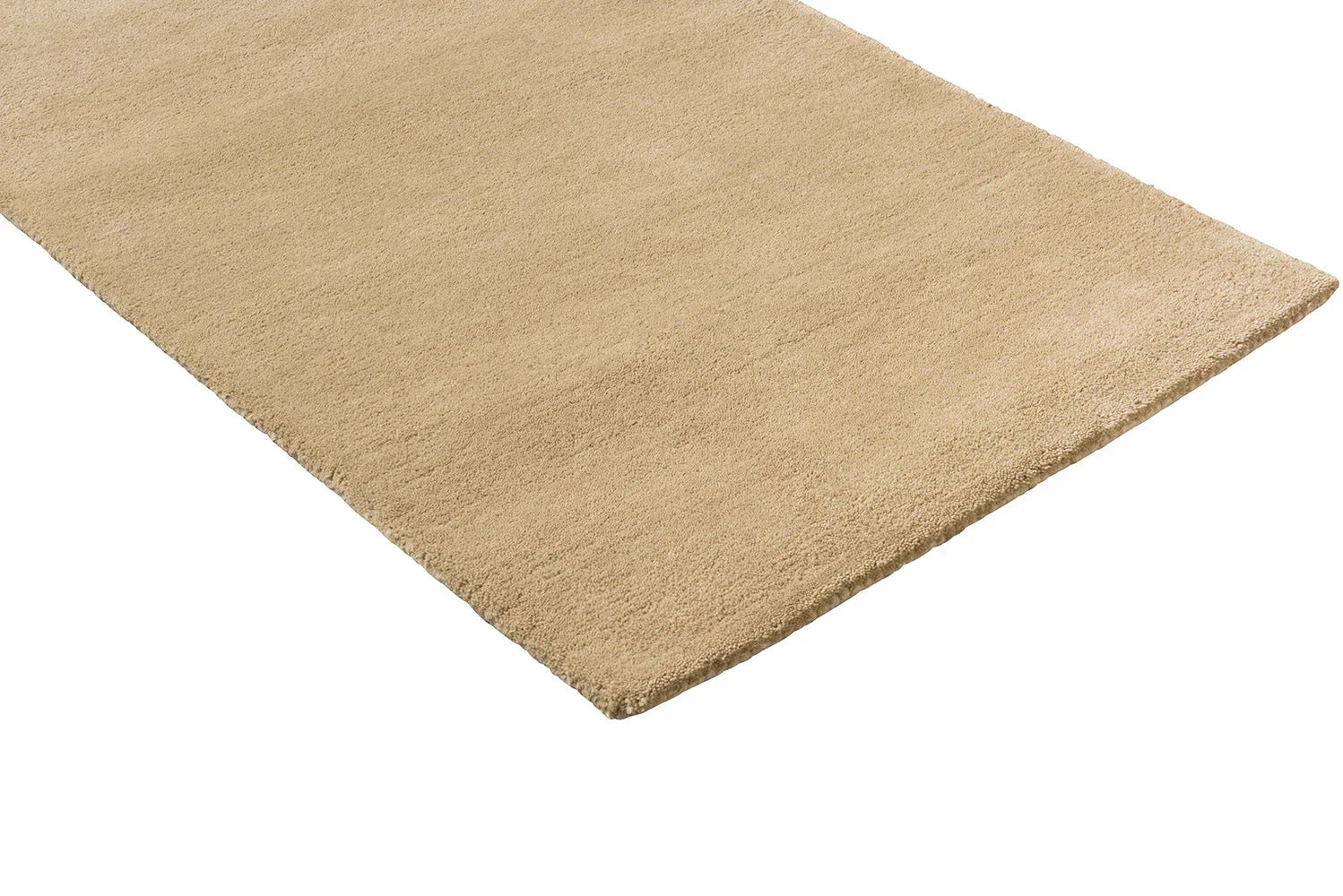 Orla Kiely Flower Placement Runner Rug in pumpkin ecru with a plain textured surface on beige, Brink & Campman