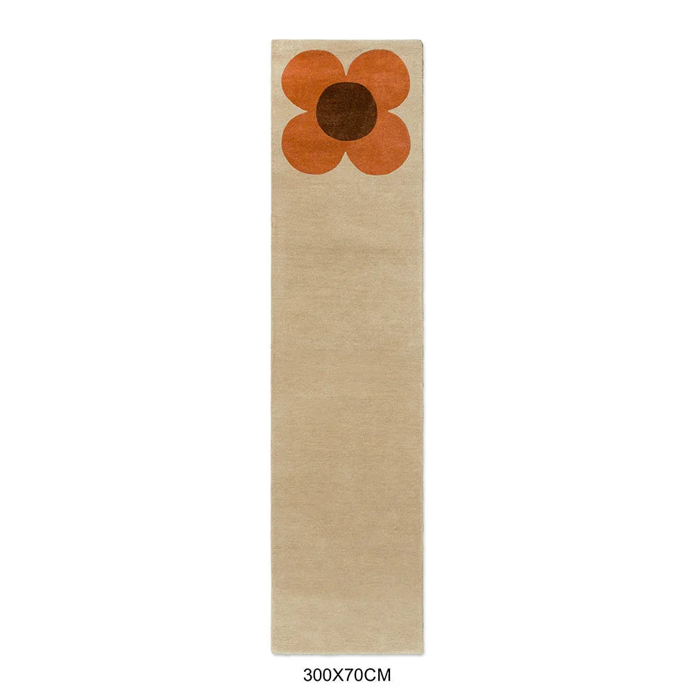 Orla Kiely Flower Placement Runner featuring floral motif in pumpkin orange, chocolate brown on ecru background, hand-tufted wool