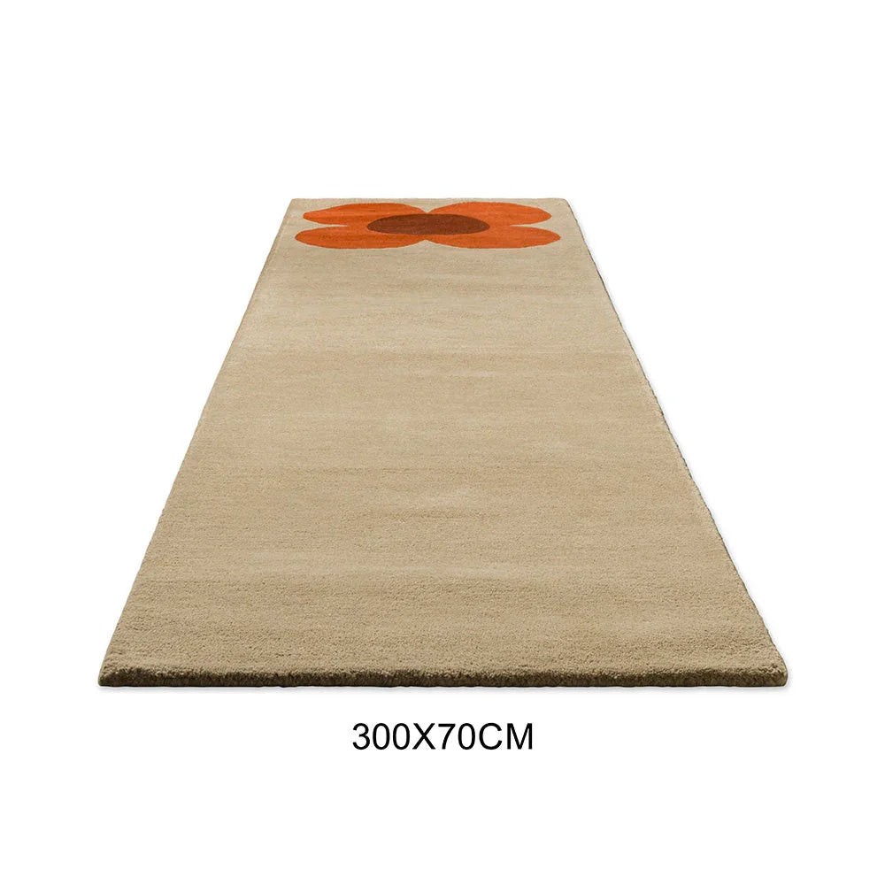 Orla Kiely Flower Placement Runner Rug featuring orange flower motif in pumpkin orange and burnt orange on beige background, hand-tufted wool