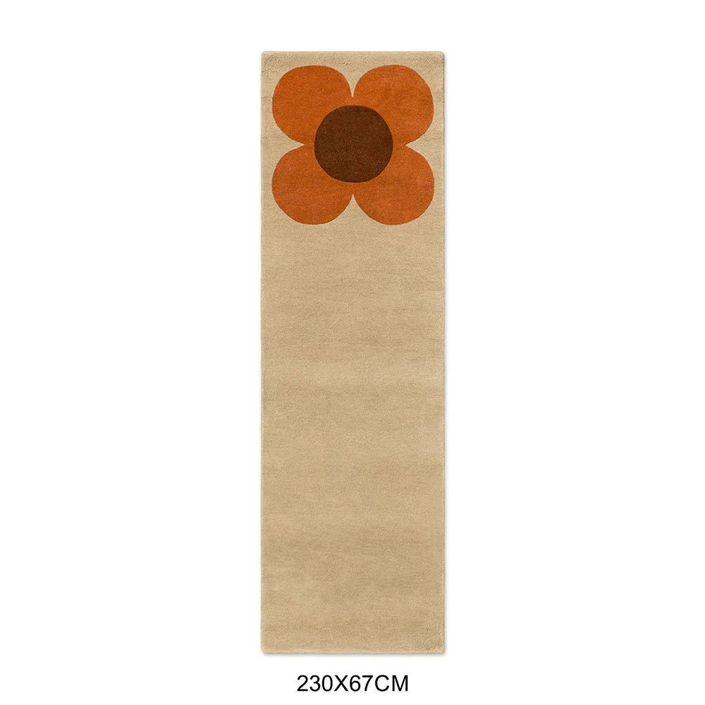 Orla Kiely Flower Placement Runner featuring large orange flower with brown center on cream background, hand-tufted wool