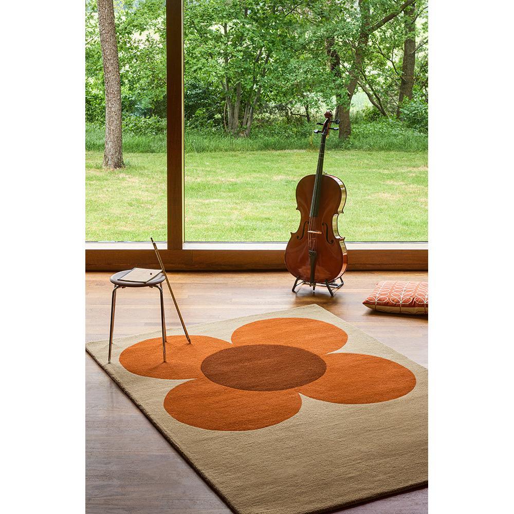 Orla Kiely Flower Placement Pumpkin Ecru Designer Rug featuring large orange flower pattern on cream background, hand-tufted wool