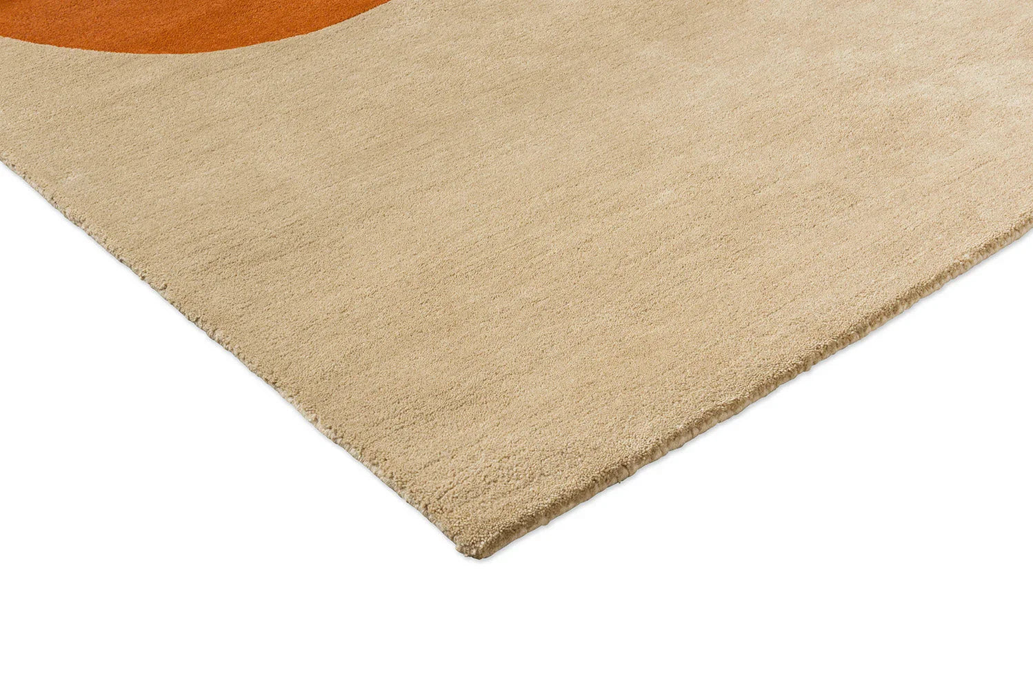 Orla Kiely Flower Placement rug featuring abstract floral motif in pumpkin orange on beige ecru background