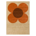 Orla Kiely Flower Placement Pumpkin Ecru hand-tufted wool rug featuring oversized iconic geometric flower bloom in warm pumpkin orange with chocolate brown centre on soft ecru cream background
