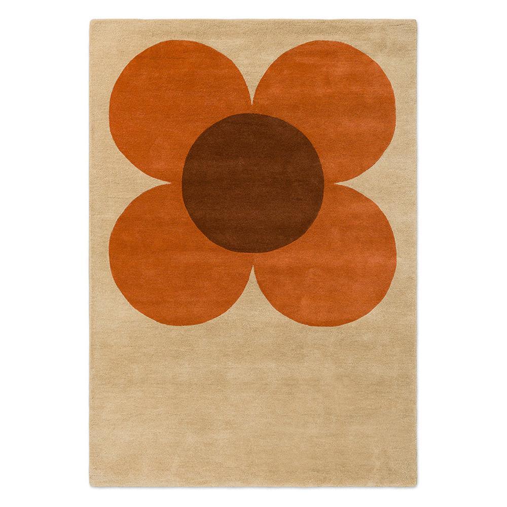 Orla Kiely Flower Placement Pumpkin Ecru hand-tufted wool rug featuring oversized iconic geometric flower bloom in warm pumpkin orange with chocolate brown centre on soft ecru cream background
