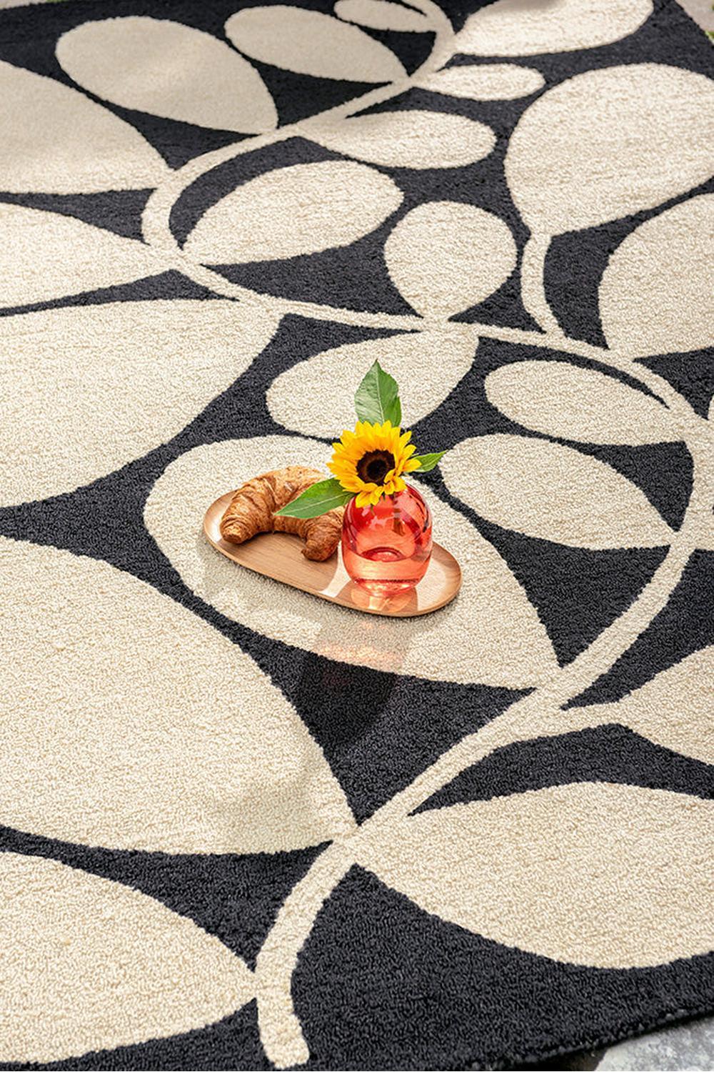 Orla Kiely Sycamore Black Designer Outdoor Rug featuring botanical leaf pattern in black and cream on beige background, power-loomed polypropylene