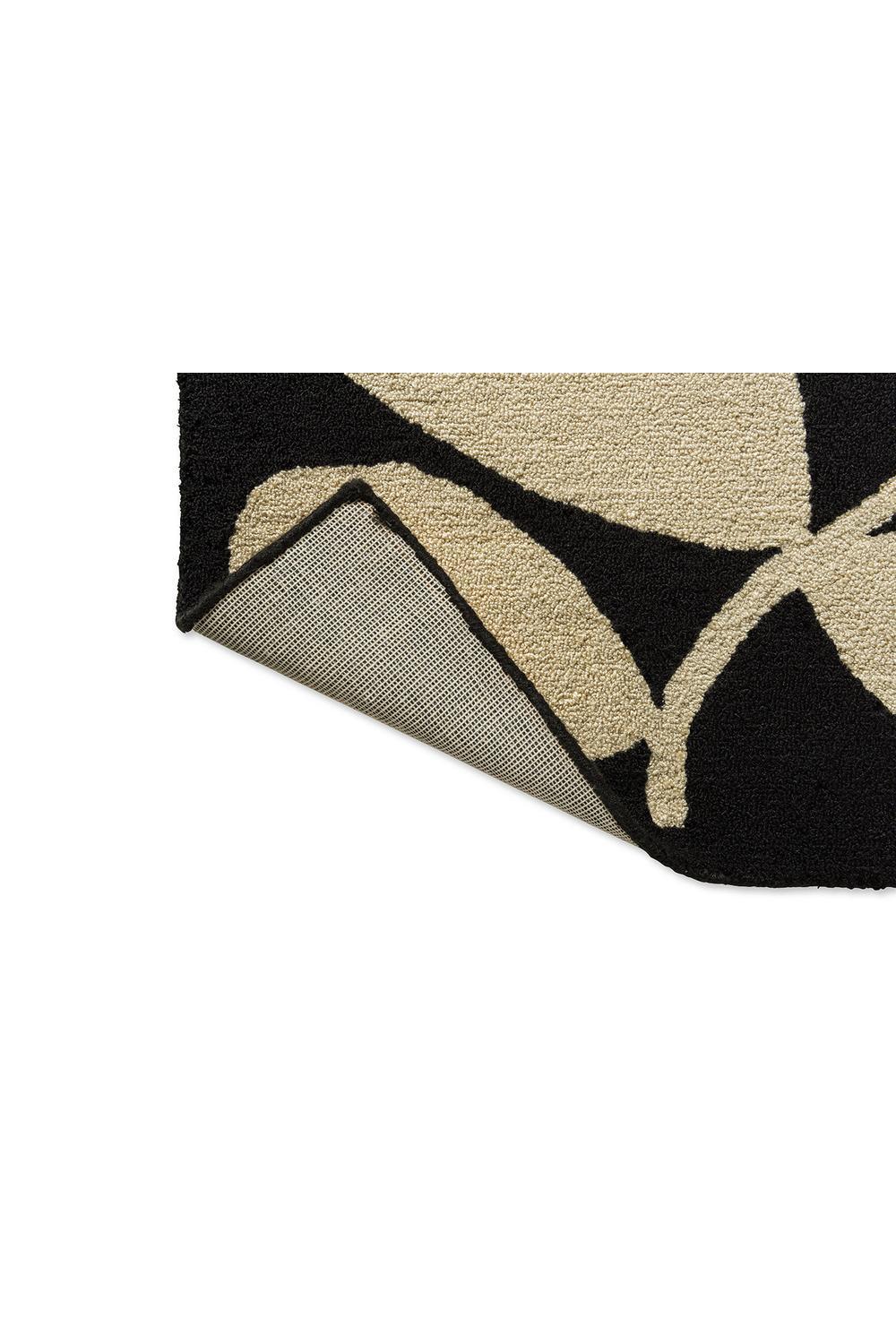 Orla Kiely Sycamore Black outdoor rug featuring botanical leaf pattern in black and beige on cream background, power-loomed polypropylene