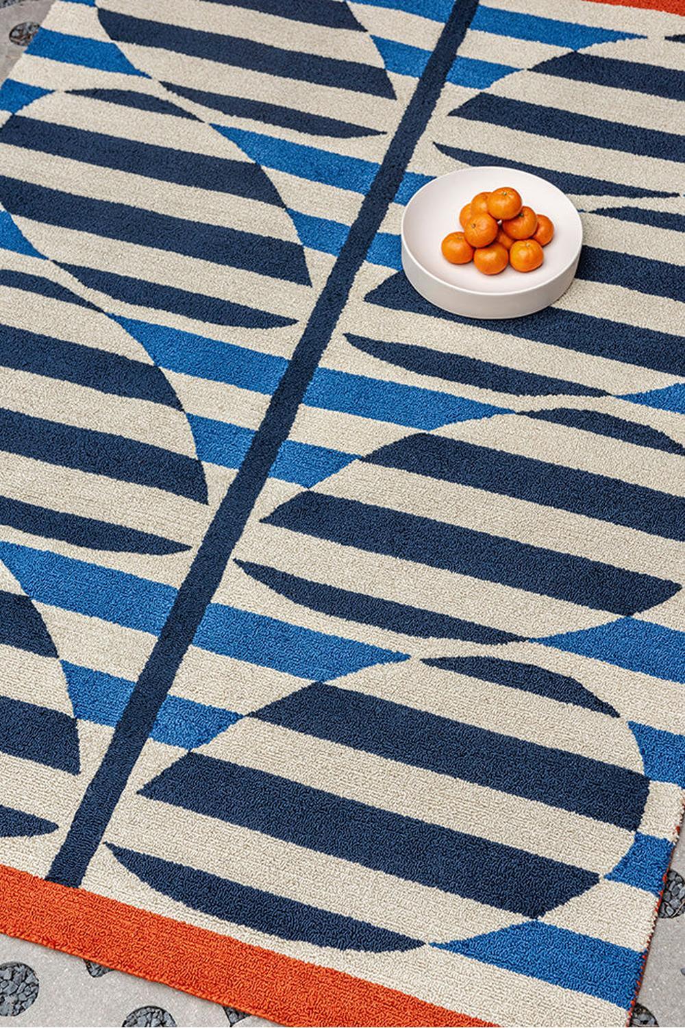Orla Kiely Stripy Stem Azure Outdoor Rug featuring geometric navy, cream, azure blue and orange stems on cream background, power-loomed polypropylene