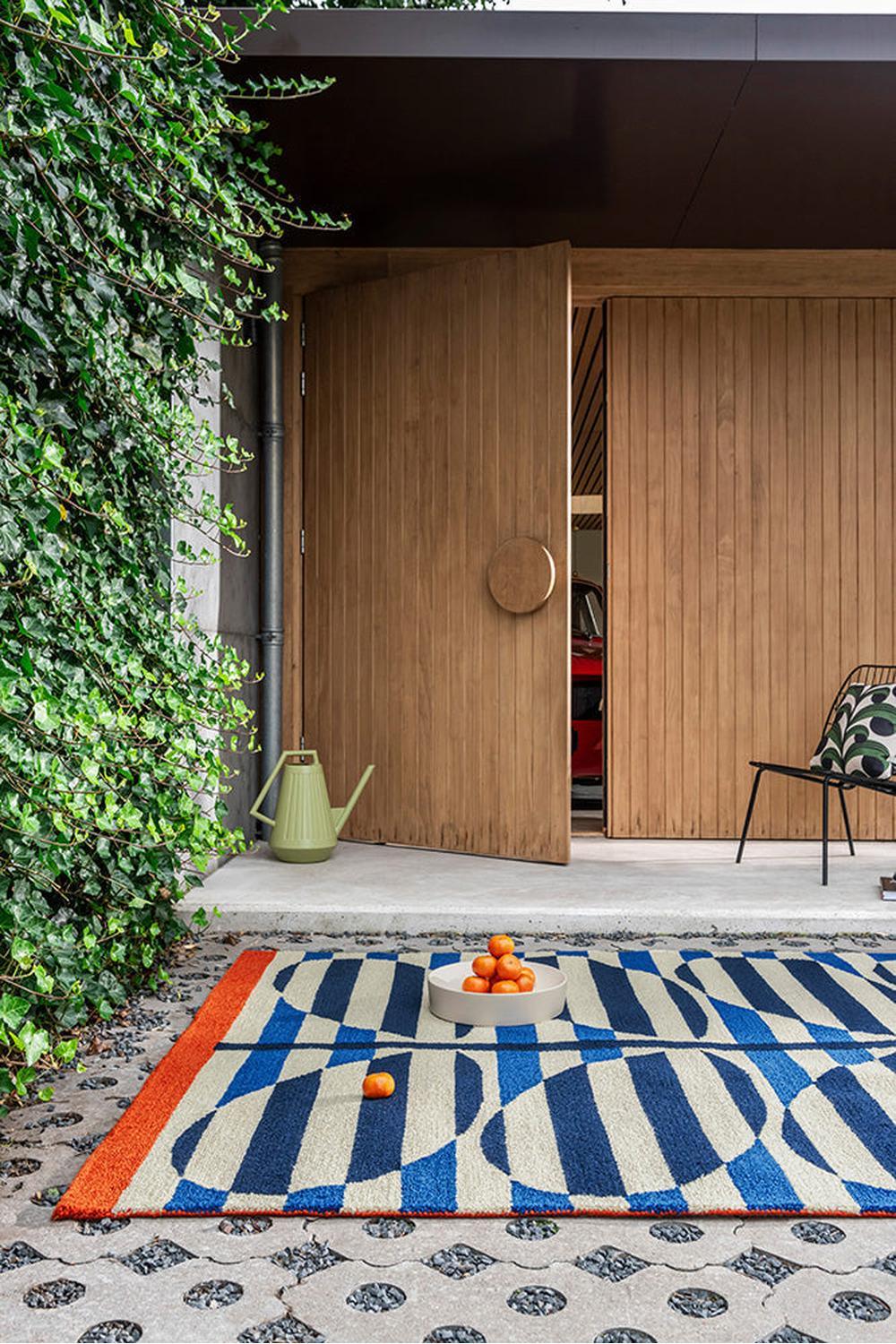 Orla Kiely Stripy Stem Azure Designer Outdoor Rug featuring stem-pattern in azure blue, cream and orange on ivory background, power-loomed polypropylene