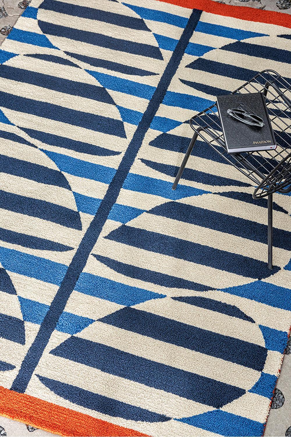 Orla Kiely Stripy Stem Azure Outdoor Rug featuring geometric stripe pattern in navy, azure, cream and orange on beige background, power-loomed polypropylene