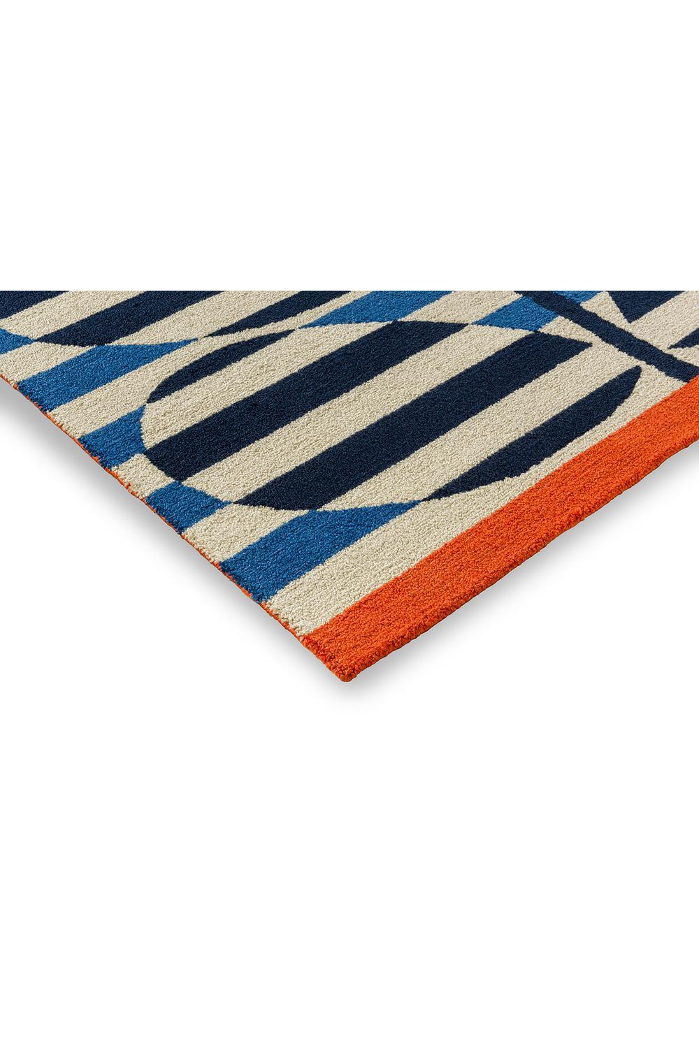 Orla Kiely Stripy Stem Azure Outdoor Rug featuring bold stripe pattern in cream, navy, azure and orange on light background, outdoor-safe construction