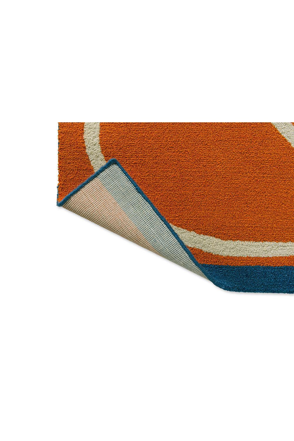 Orla Kiely Linear Stem Orange Outdoor Rug featuring curved cream lines in orange, cream, navy and teal on white background, outdoor weave