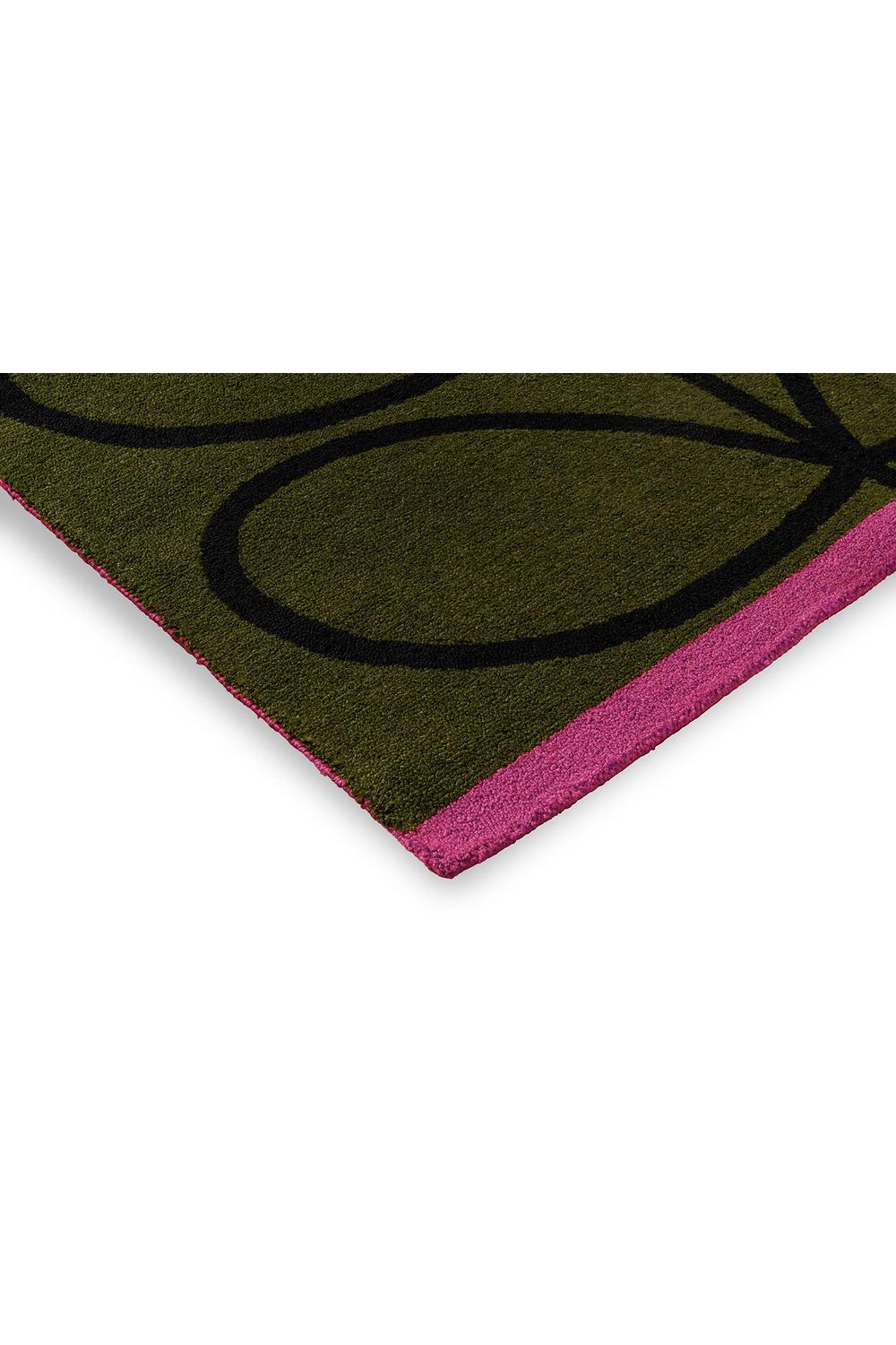 Orla Kiely Linear Stem Olive Designer Outdoor Rug featuring stem pattern in olive green, black and magenta on pink border, power-loomed polypropylene