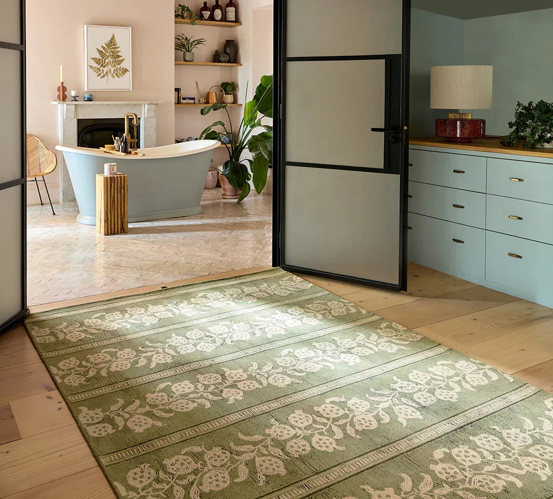 Sanderson Anaar Forest Green Designer Rug featuring floral pattern in forest green and ivory on pale beige, hand-tufted