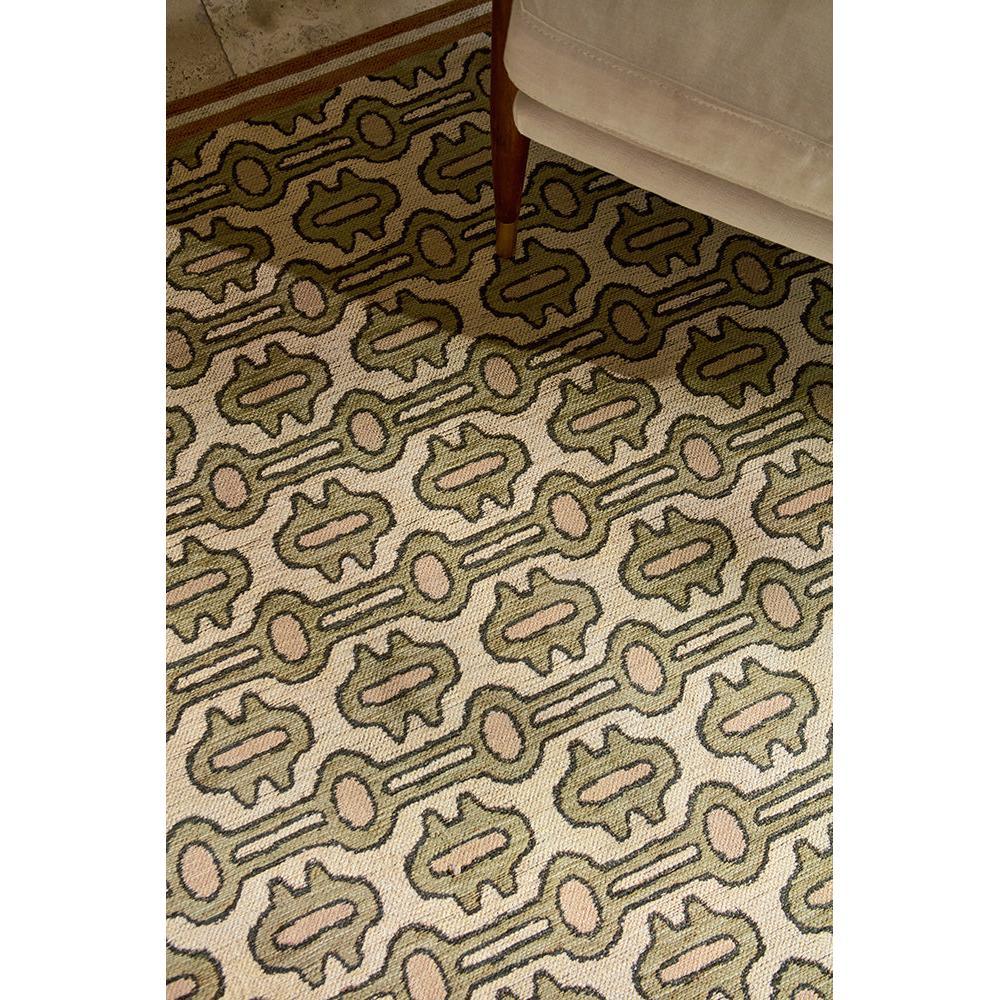 Sanderson Matmi Avocado Rug featuring abstract geometric pattern in olive green, pink and taupe on beige, machine-woven wool