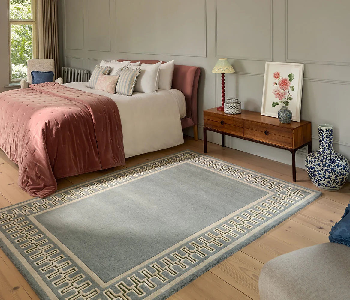Sanderson Linnean Porcelain Designer Rug featuring Greek-key border in ivory/cream on powder blue field, hand-tufted wool
