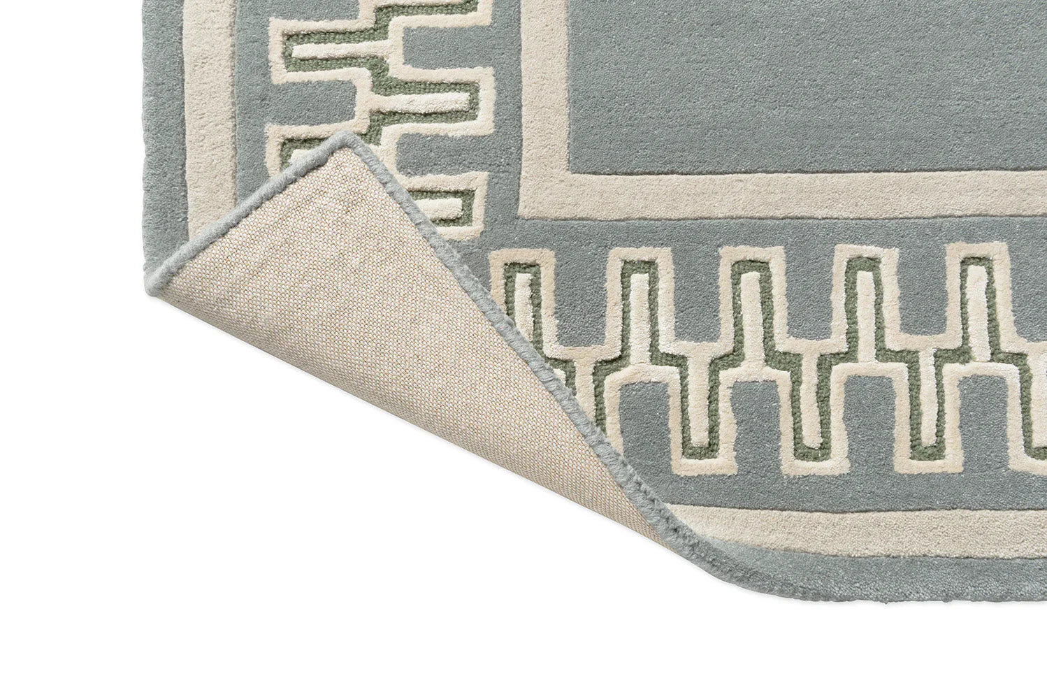 Sanderson Linnean Porcelain rug featuring geometric border in blue-grey, cream and sage green on grey-blue field, hand-tufted wool