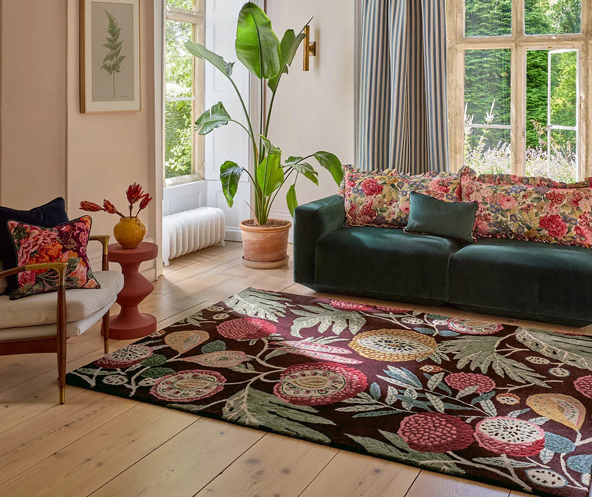 Sanderson Jackfruit Cherry Alabaster Rug featuring floral pattern in pink, coral, lime and cream on dark brown backdrop, hand-tufted wool