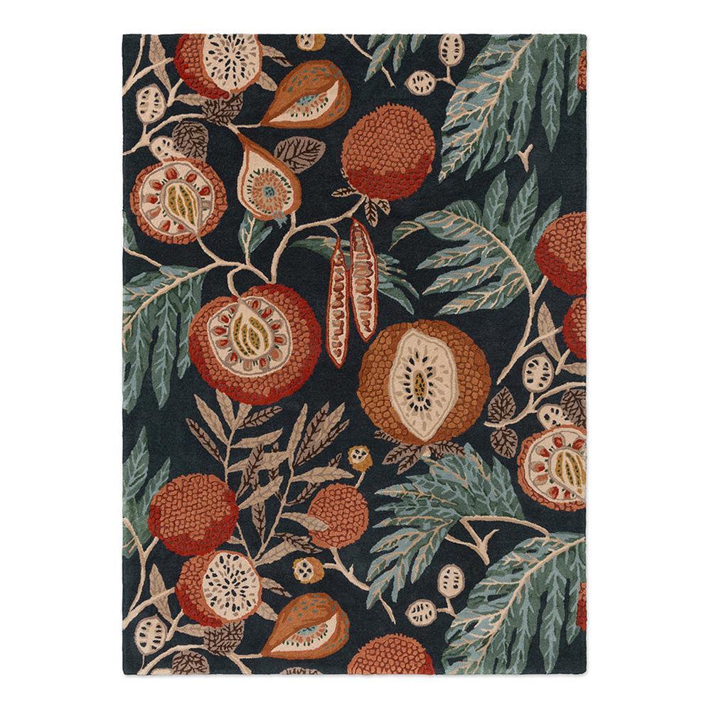 Sanderson Jackfruit Turmeric Indigo hand-tufted wool rug featuring exotic stylised jackfruit botanical design in rust, terracotta, and ochre with jade green foliage on charcoal background
