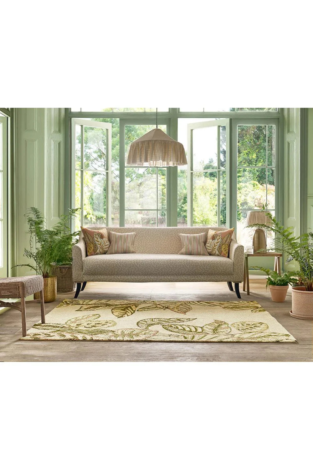 Sanderson Calathea Samphire Outdoor Rug featuring botanical leaf pattern in olive, sage, lime on cream background, power-loomed polypropylene
