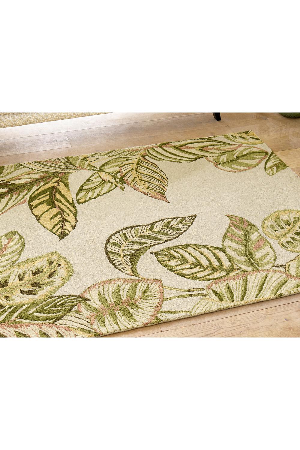 Sanderson Calathea Samphire outdoor rug featuring tropical leaf pattern in olive green, sage, moss and pink on cream background, machine-made polypropylene