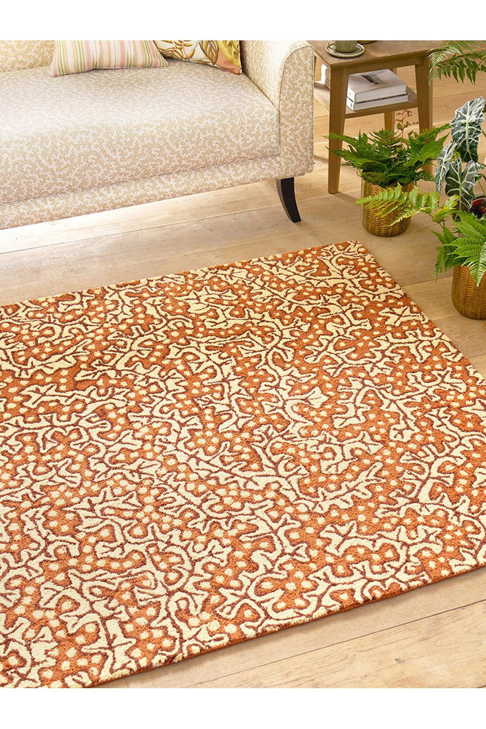 Sanderson Truffle Sandstone Outdoor Rug featuring abstract scrolling pattern in burnt orange and cream on ivory, power-loomed polypropylene