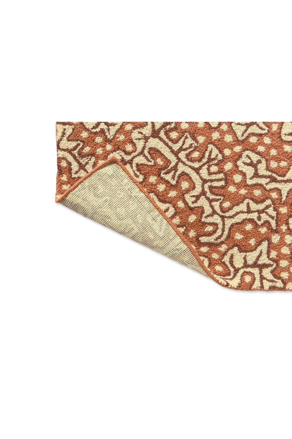Sanderson Truffle Sandstone outdoor rug featuring ornate botanical pattern in burnt orange and cream on sand background, power-loomed polypropylene