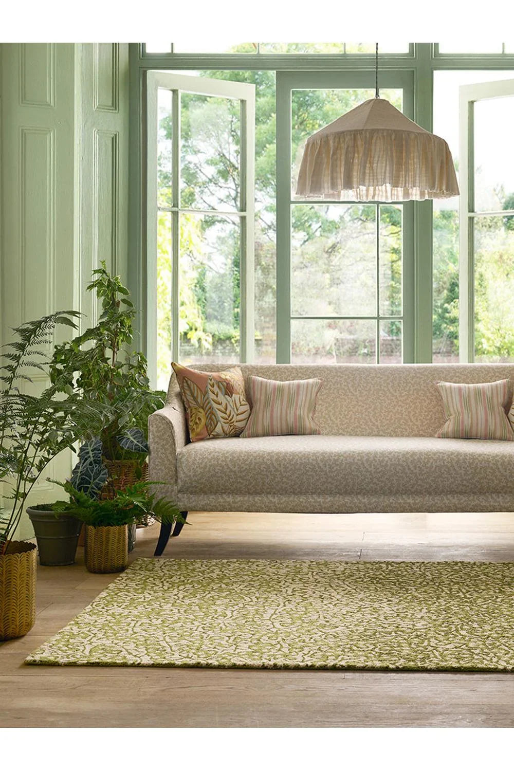 Sanderson Truffle Olive Outdoor Rug featuring botanical pattern in olive, sage & cream on pale background, power-loomed polypropylene