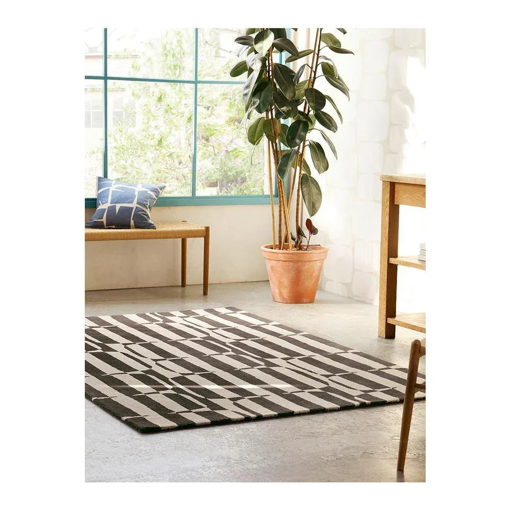 Scion Lohko Stripe-charcoal Designer Rug featuring bold geometric stripe pattern in charcoal, ivory and taupe on light-grey floor, machine-made polyester