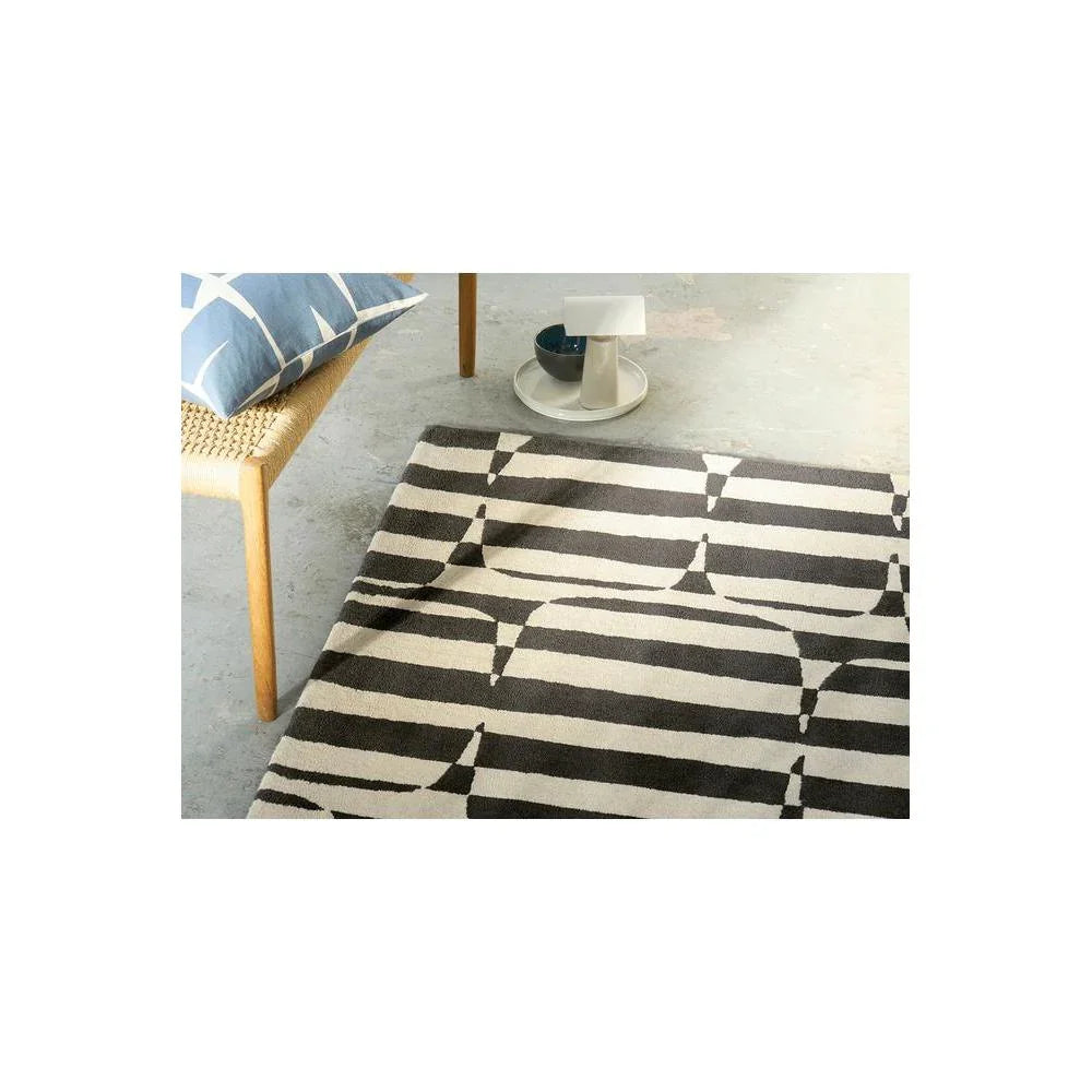 Scion Lohko Stripe-charcoal Designer Rug featuring geometric stripe pattern in charcoal, ivory and cream on light beige background, woven wool