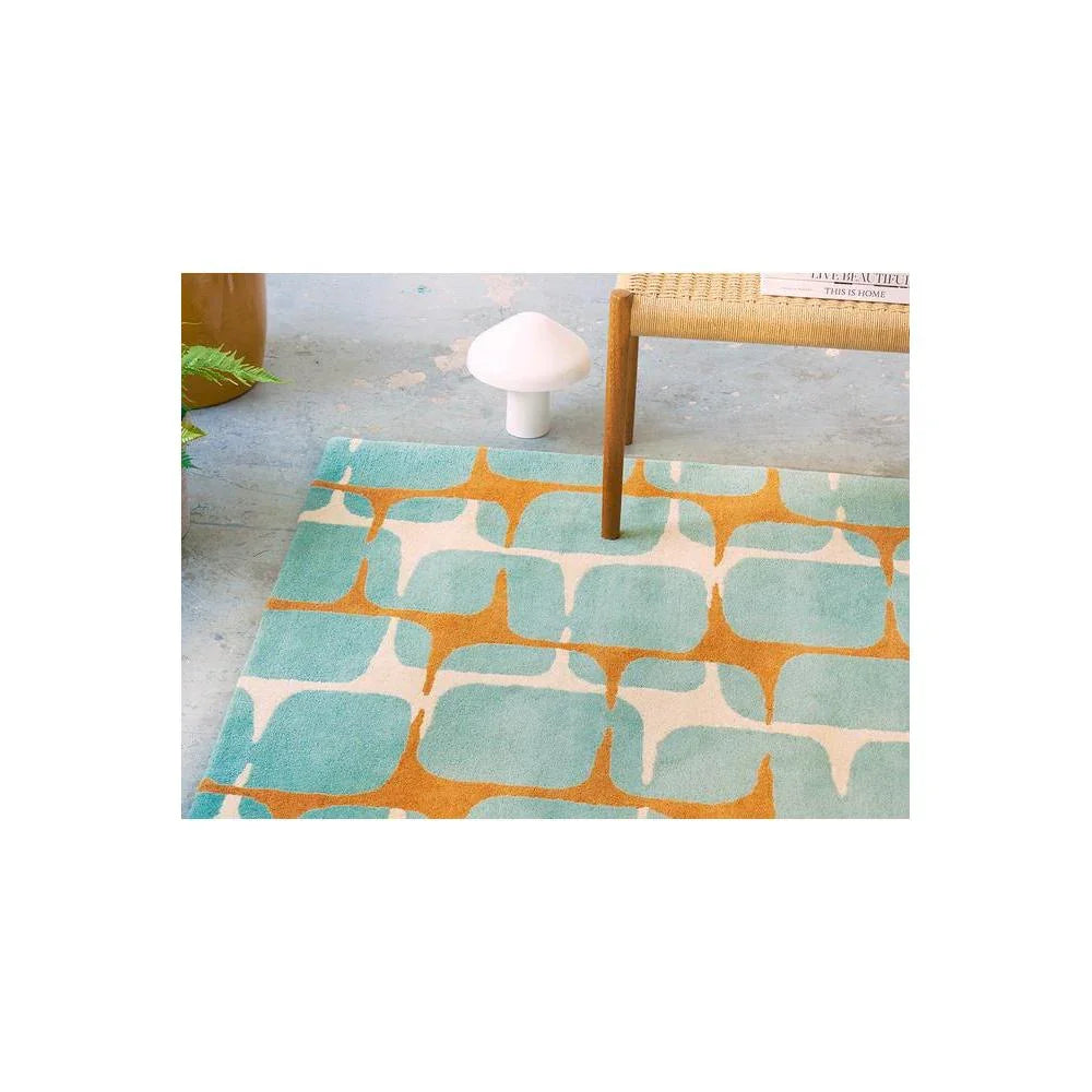 Scion Going Lohko - Sky Designer Rug featuring abstract geometric lattice in turquoise, teal, burnt orange on cream background, hand-tufted wool